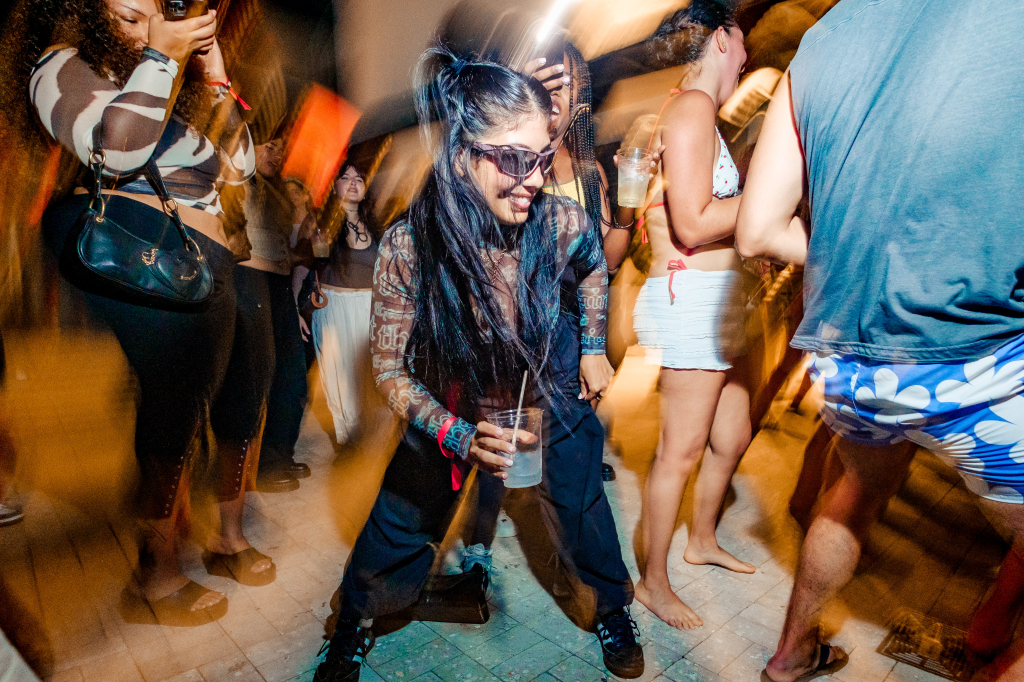 Photo of a woman dancing at a party in Miami. 