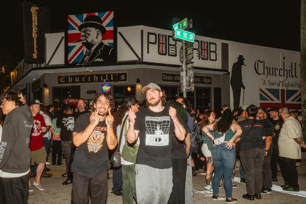 Photo of a group of people outside a venue with a sign that reads Churchill's