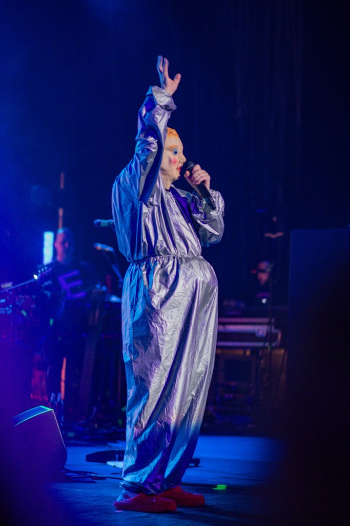 Photo of one of Devo's iconic personas on stage in Miami
