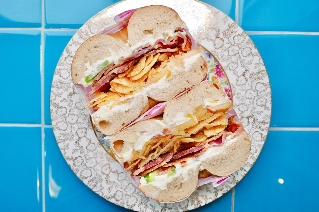 a bagel sandwich with a blue background