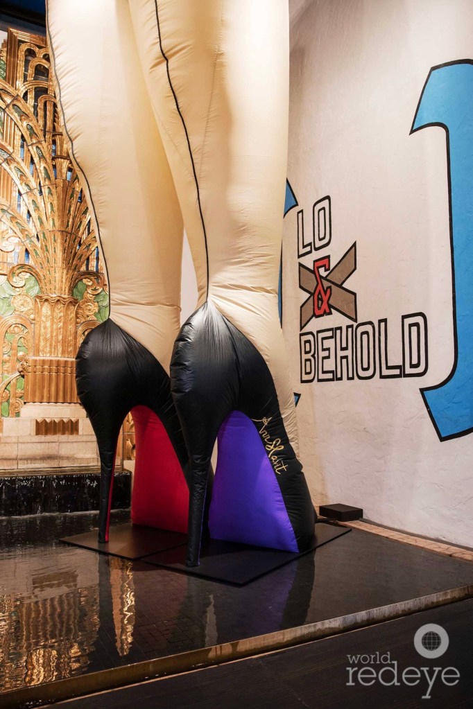 photo of a pair of inflatable legs and heels inside a gallery