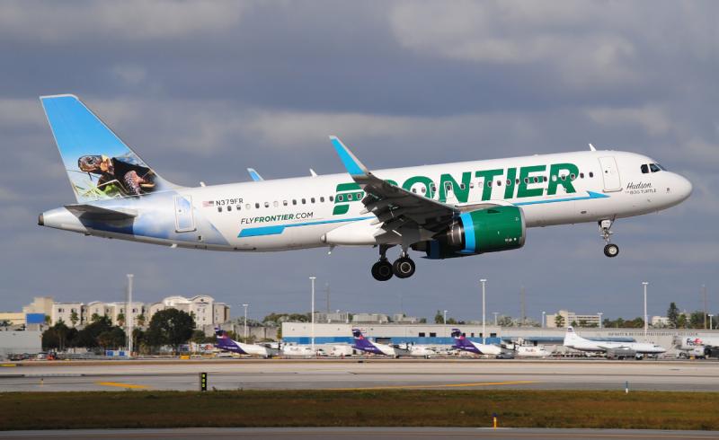 A Frontier airlines plane in flight.