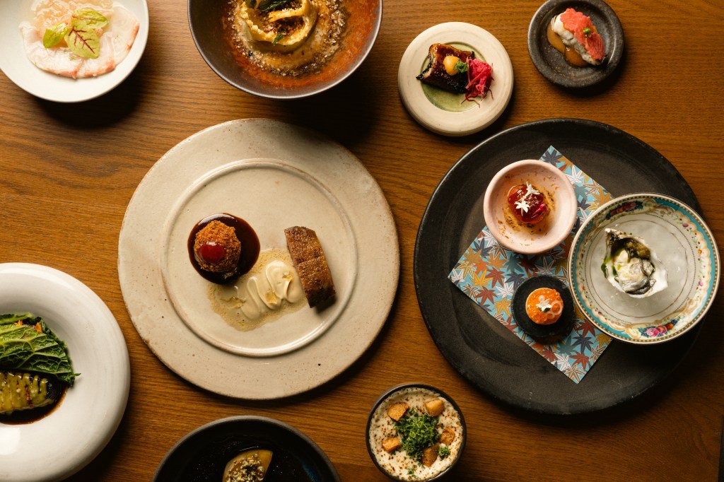 an assortment of dishes on a wood table