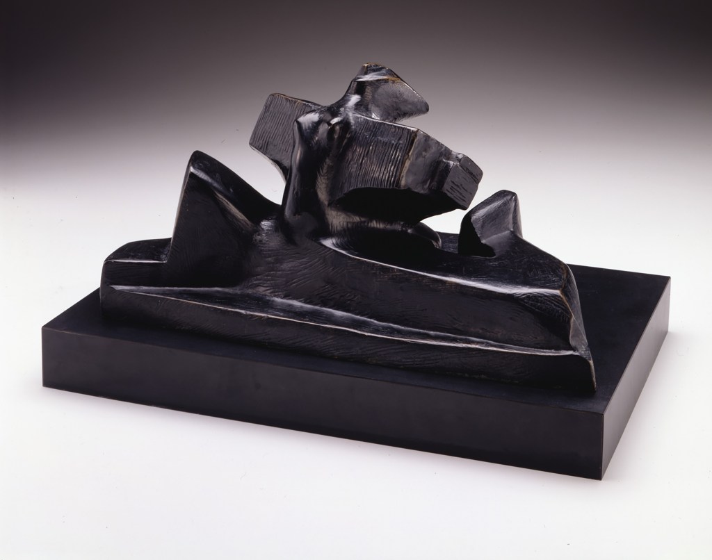 photo of a black sculpture on display in a gallery