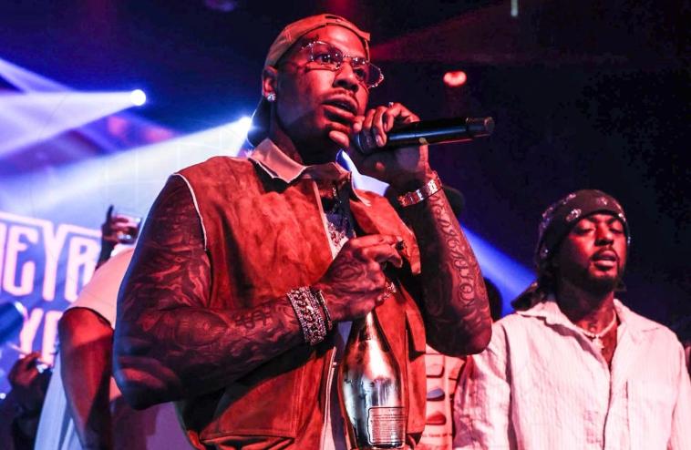 photo of rapper Moneybagg Yo onstage inside a club