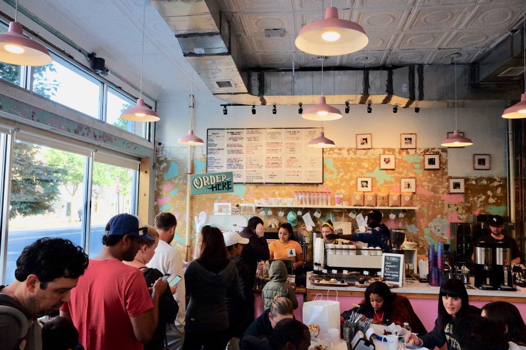 a packed dining room and ordering counter area