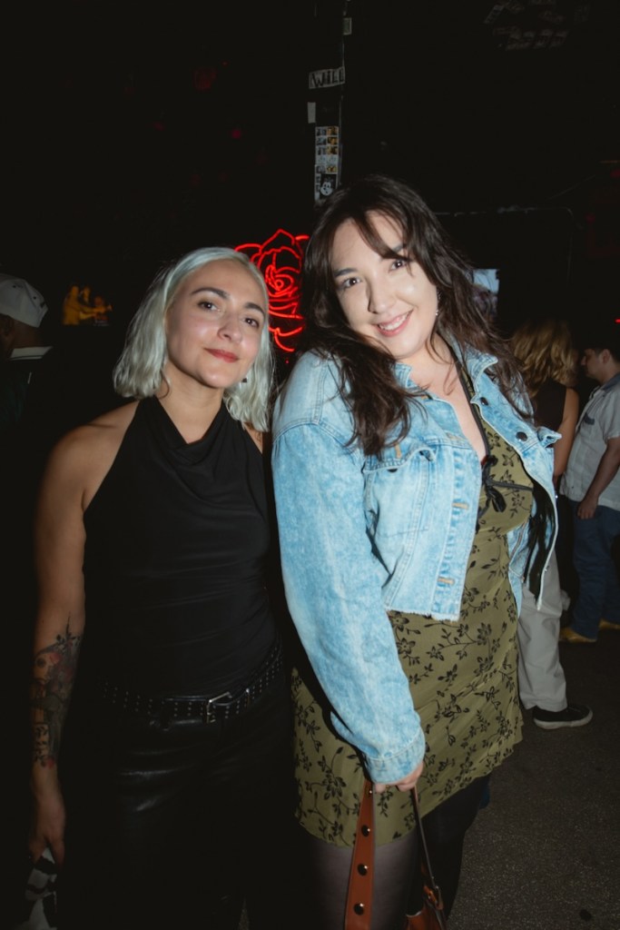 Photo of two woman posing for the camera at a Miami bar
