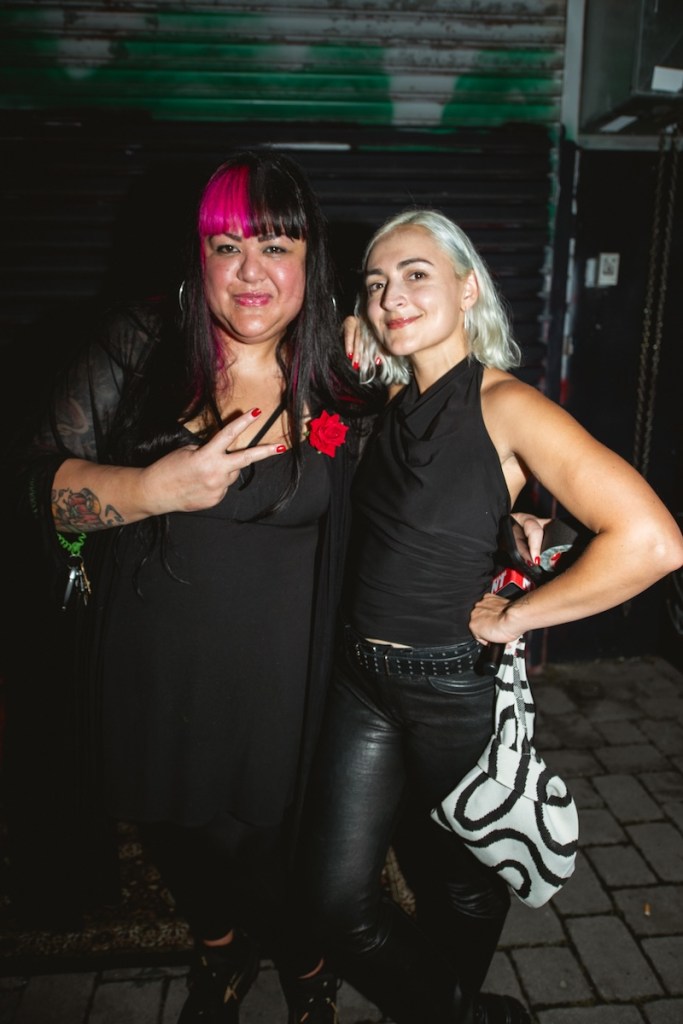 Photo of two woman posing for the camera at a Miami bar