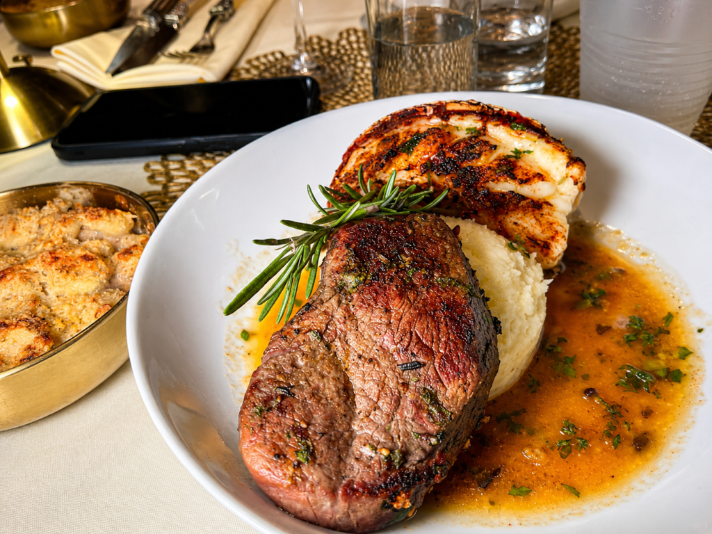 a photo of steak and mashed potatoes on a white plate