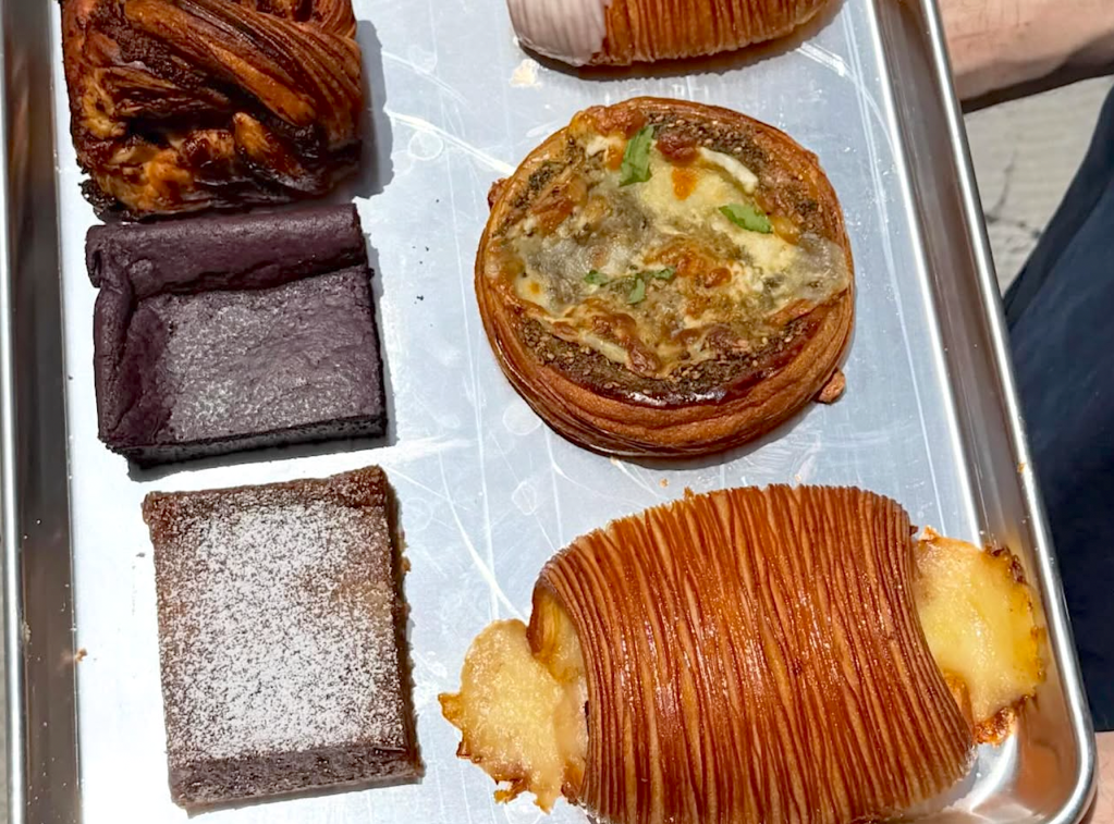 an assortment of pastries on a sheet pan