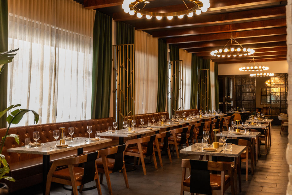 a dining room with modern chandeliers