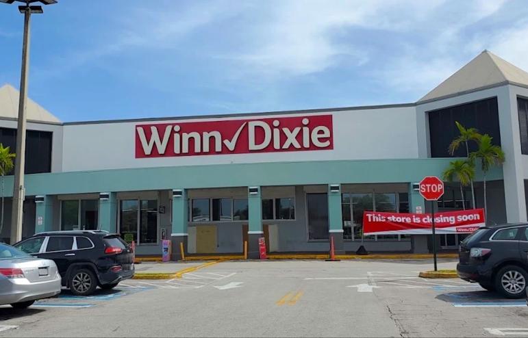 the blue and white exterior facade of the former Winn-Dixie