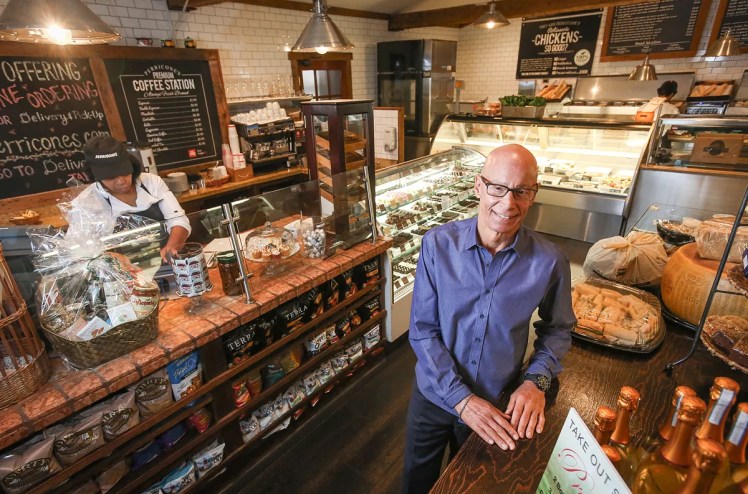 A man posing at a restaurant.