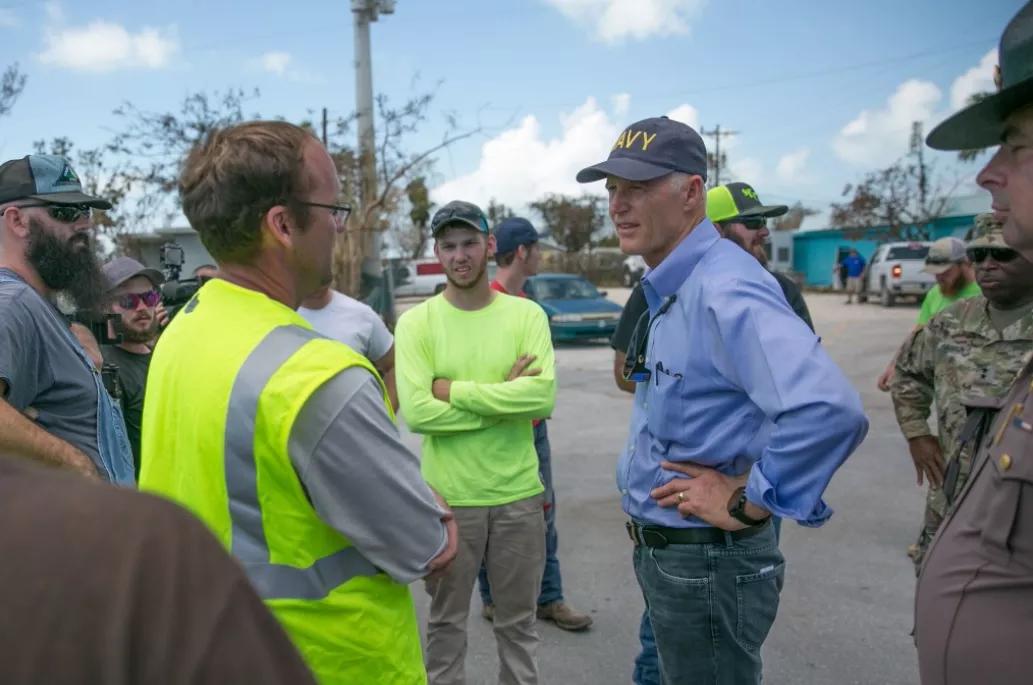 Why Do Politicians Always Wear Baseball Caps During Natural Disasters?