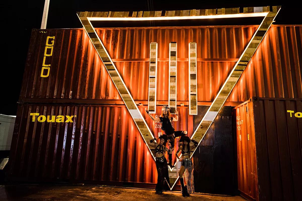 Photo of shipping containers with logo of III Points Festival