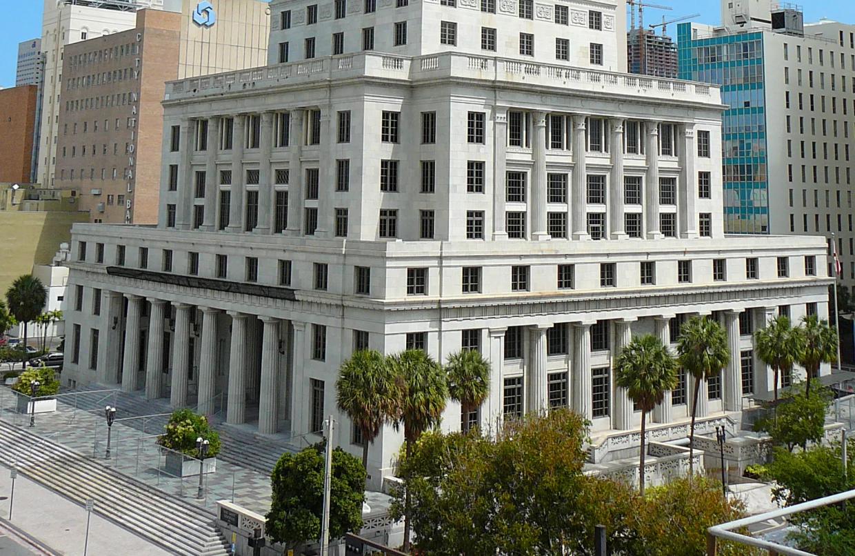 Secretary Says Asbestos at Miami-Dade Courthouse Gave Her Lung Cancer
