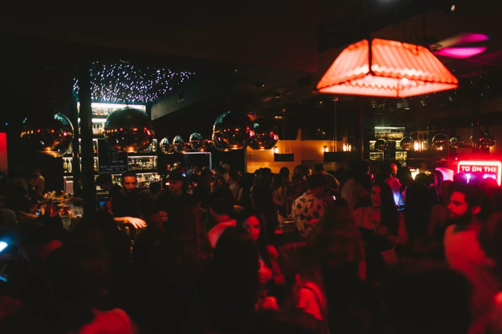 Photo of a venues in Miami with red lights.