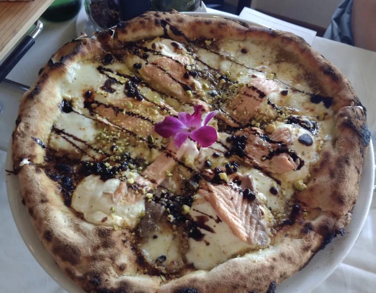 Nightly Pizza Acrobatics at Normandy Isle’s Capri New Style