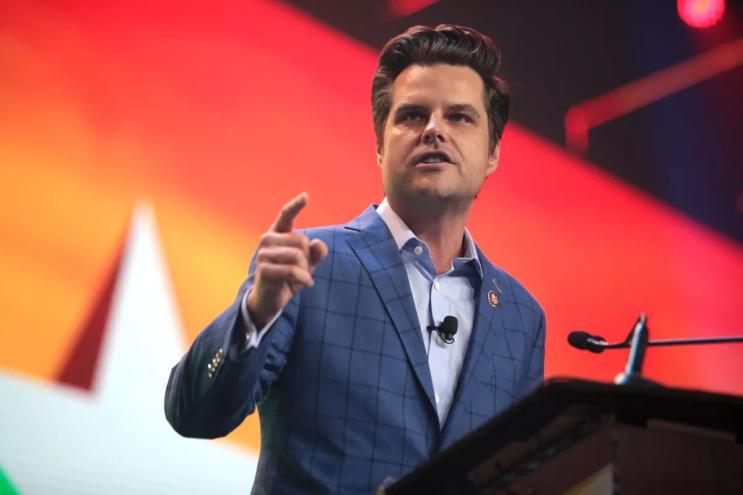 Matt Gaetz speaking at a podium.