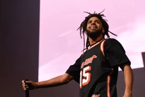 photo of rapper J. Cole performing onstage