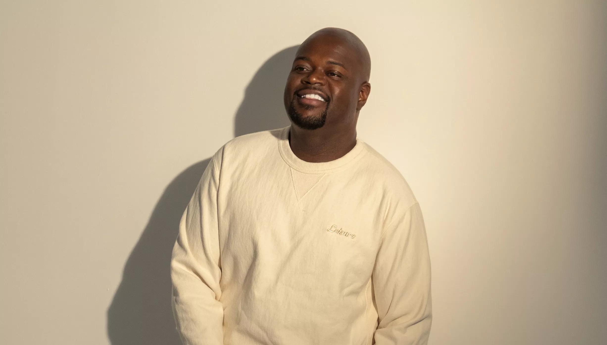 Photo of Poo Bear wearing a white sweatshirt .
