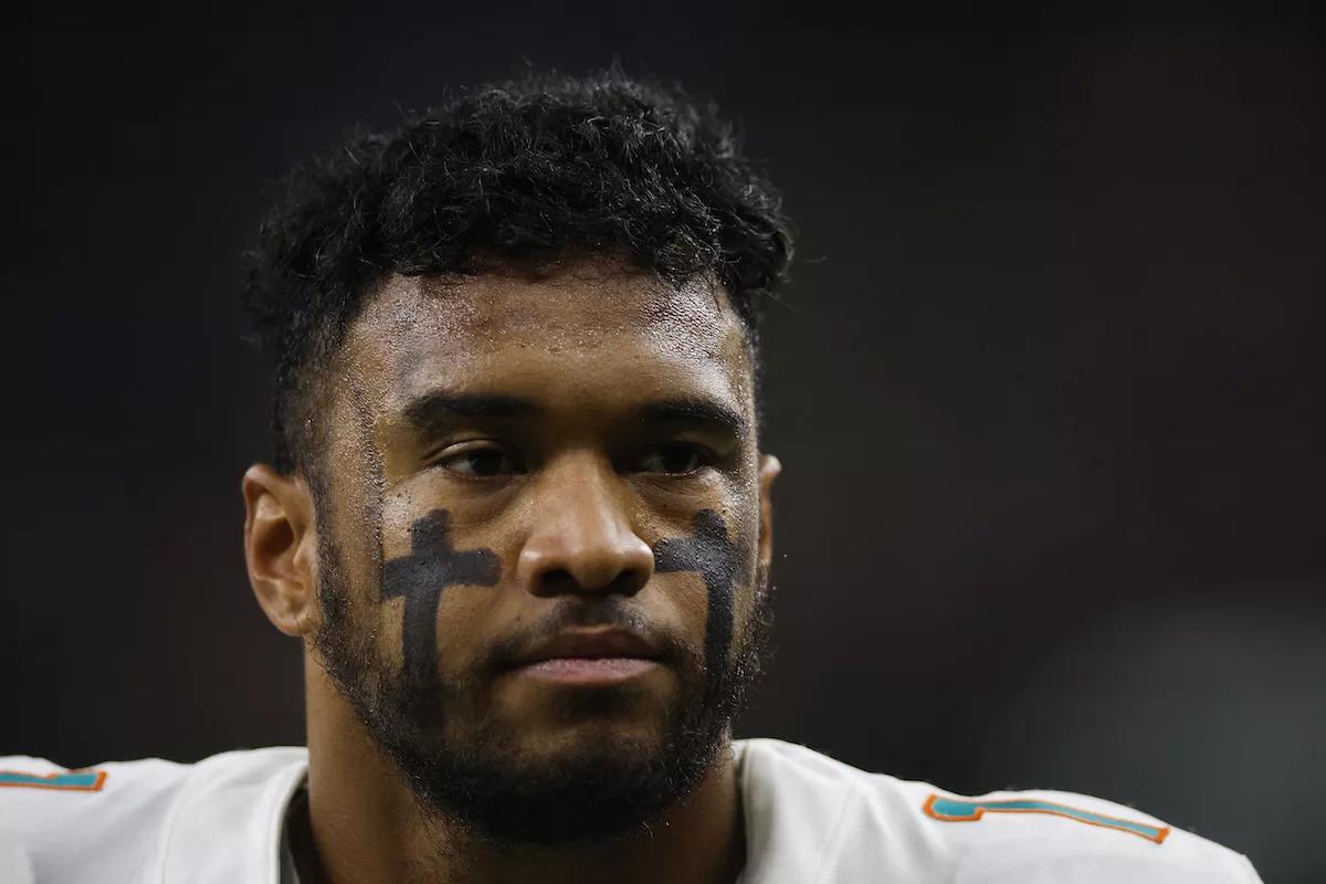 Tua Tagovailoa #1 of the Miami Dolphins looks on during pregame warm-ups prior to a game against the New Orleans Saints at Caesars Superdome on December 27, 2021 in New Orleans, Louisiana