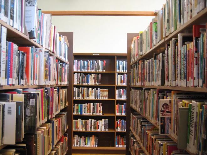 a photo of bookshelves in a library