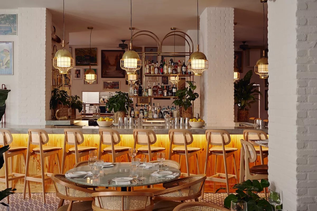 A lit bar and dining area