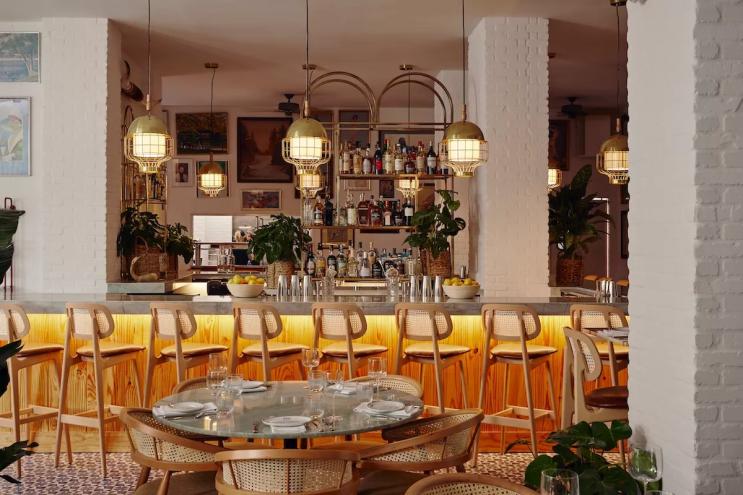 A lit bar and dining area