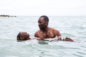 still from the movie "Moonlight" showing a man holding a young man in the ocean