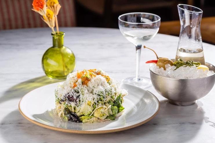 a round salad on a white table