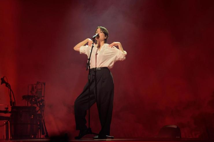 Mitski performing on stage