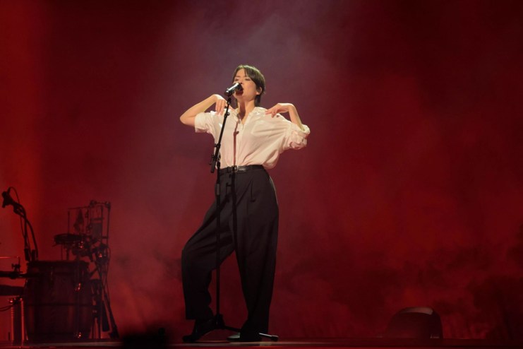 Mitski performing on stage