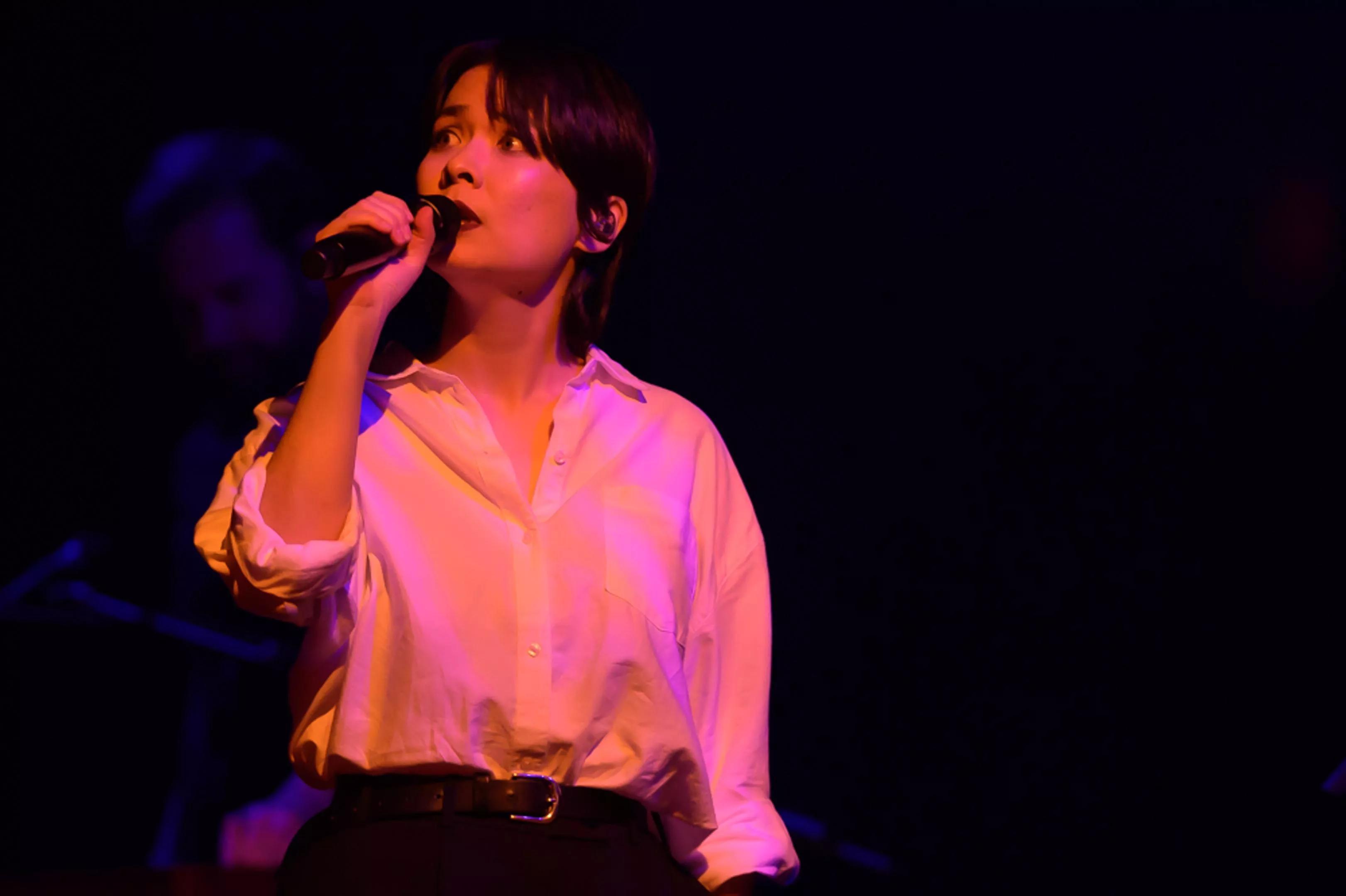 Mitski performing on stage