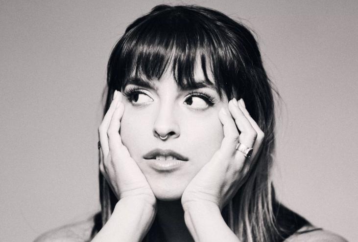 Black and white image of Gale with her hands under her chin