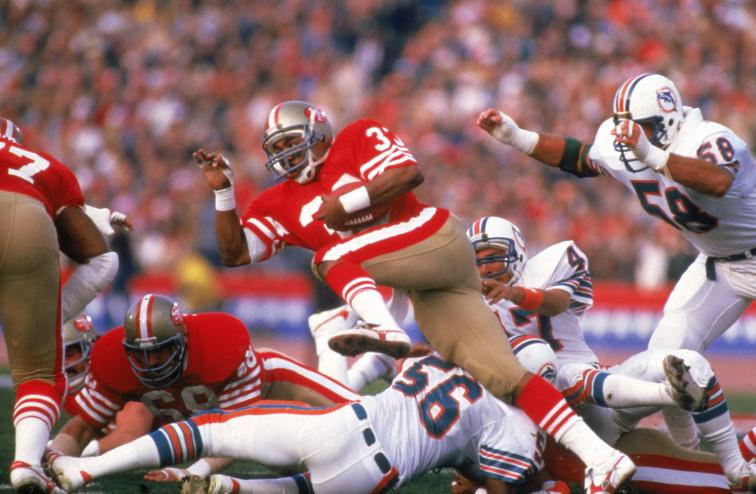 San Francisco 49ers running back rushes during Super Bowl XIX in 1985