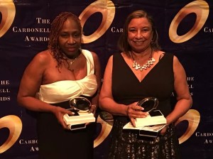 Patricia E. Williams and Shirley Richardson posing with their Carbonell trophies in hand
