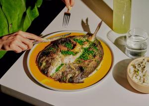 A fish dish on a yellow plate