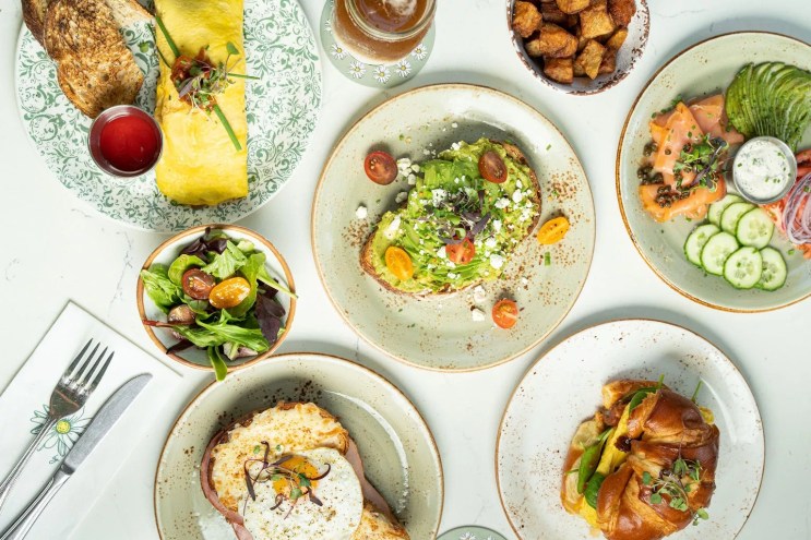 Various breakfast dishes on a table from Cafe Bastille