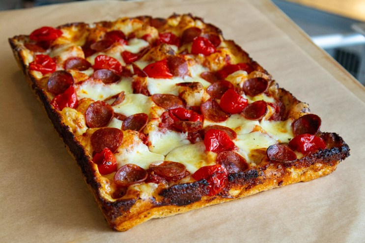 A Detroit-style pizza with toppings