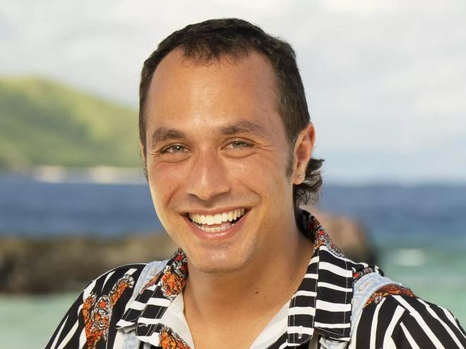 Ben Katzman's portrait of him smiling in a striped shirt