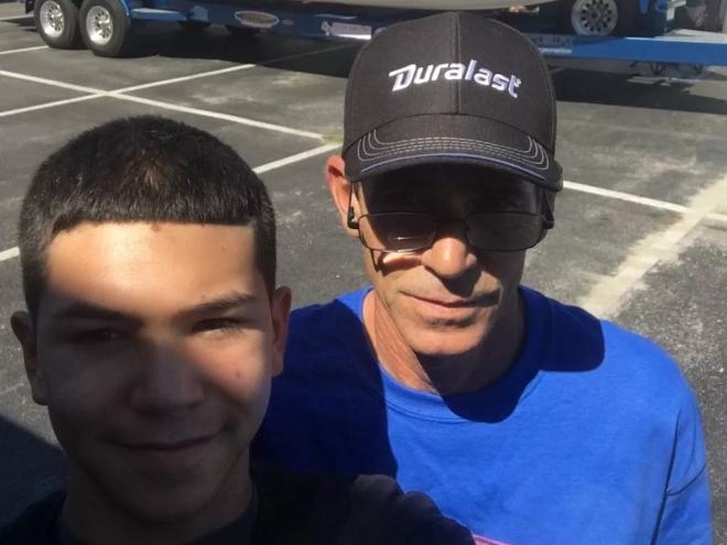 Osvaldo Cueli and his son posing for a photo