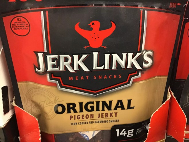 What at first appears to be a Jack Link's original-flavor beef jerky packet is, upon closer inspection, labeled "Jerk Link's Pigeon Jerky," with the Jack Link's stylized longhorn logo replaced by a figure of a dead bird with wings spread to mimic the longhorn horns