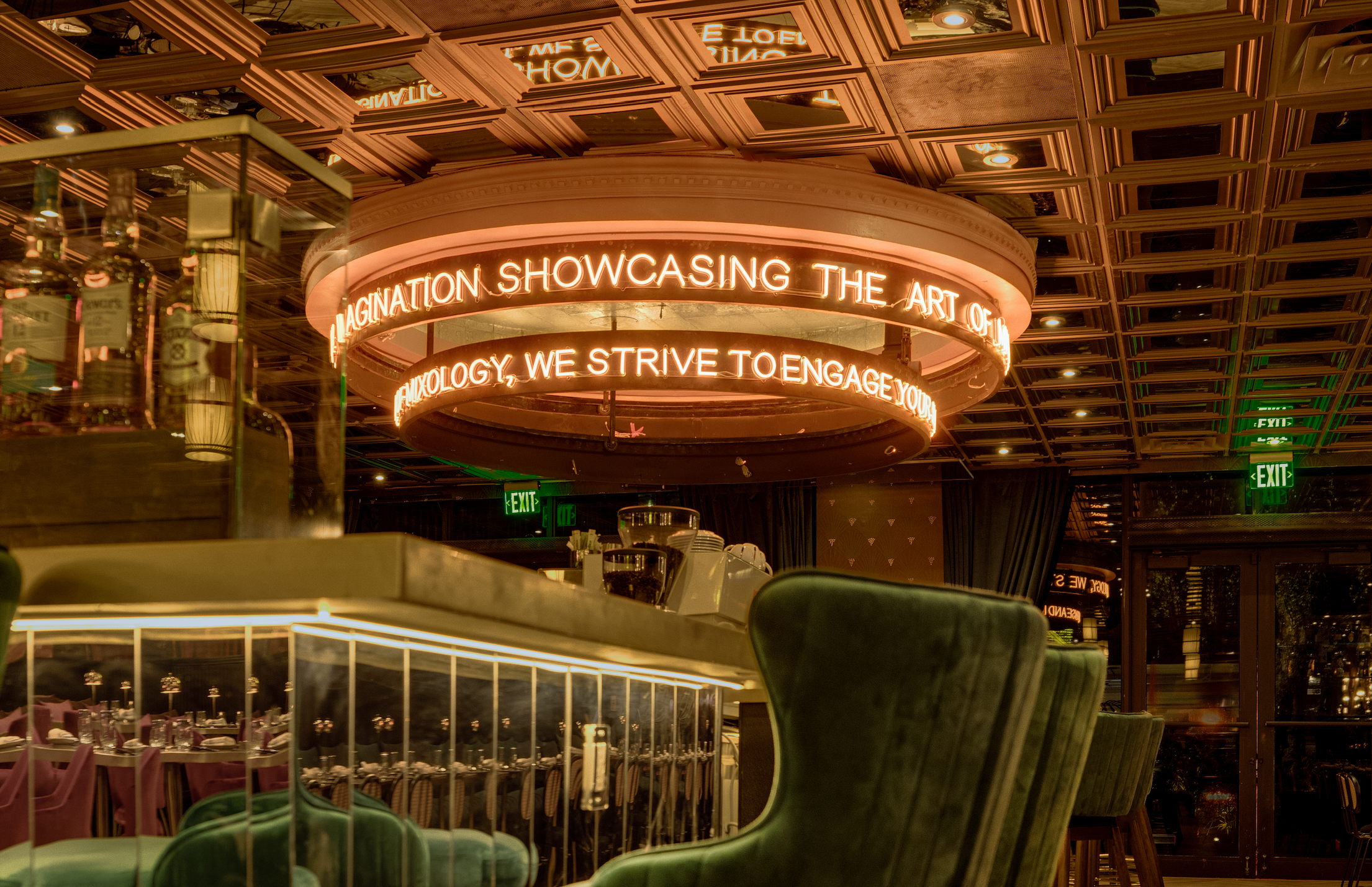 A moody bar by a chandelier