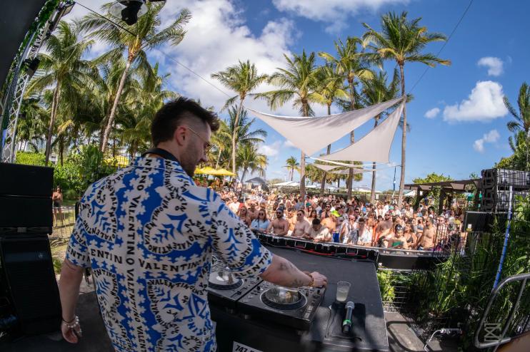 DJ spinning outdoor before a crowd