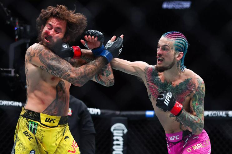 Sean O'Malley lands a hard right hand to the face of Marlon Vera's already bloodied face during UFC 299