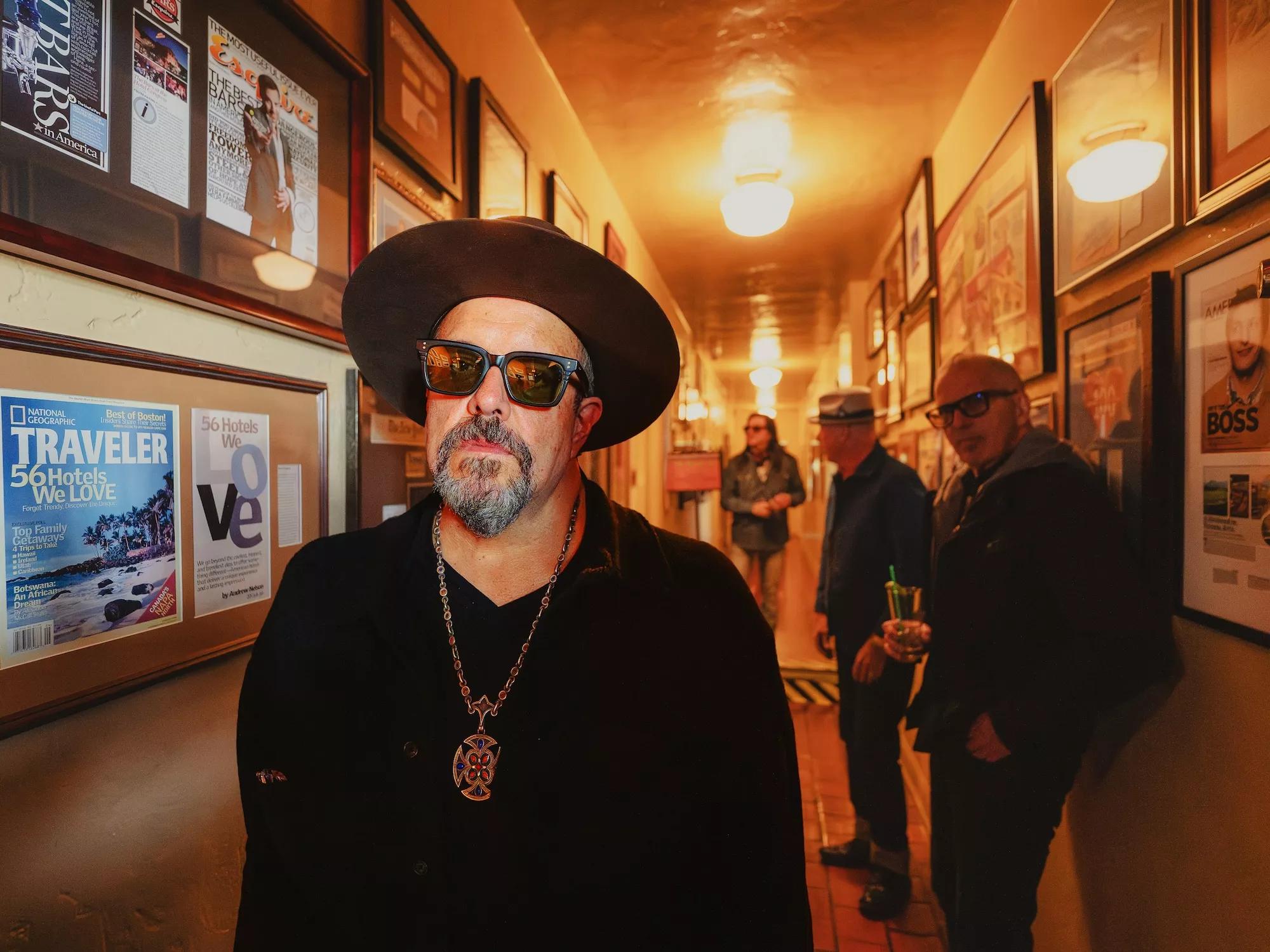 The four members of the Mavericks standing in a hallway