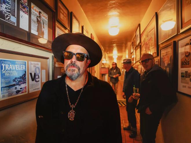 The four members of the Mavericks standing in a hallway