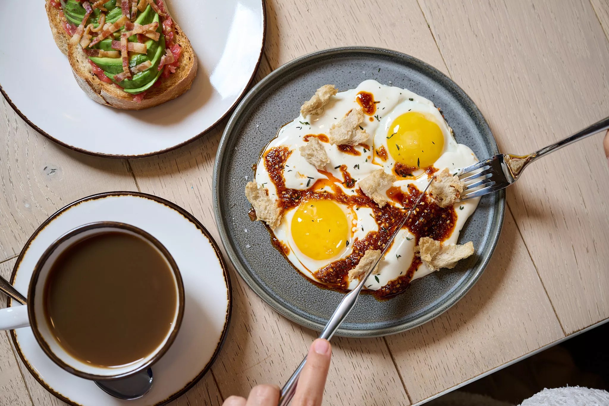 Two dishes on plates on a wooden table