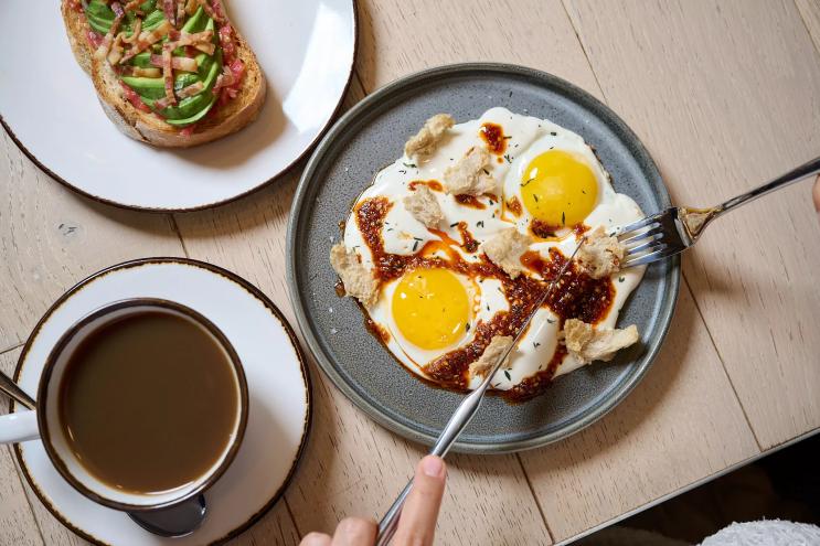Two dishes on plates on a wooden table